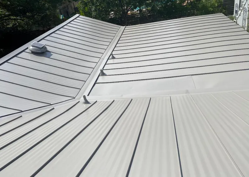 Solar attic fan installed on a metal roof for Roof Ventilation in Village of Oak Creek (Big Park)